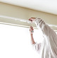 Painter completing interior finish work