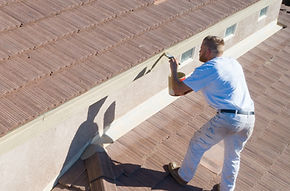 Painter applying a finish with a brush